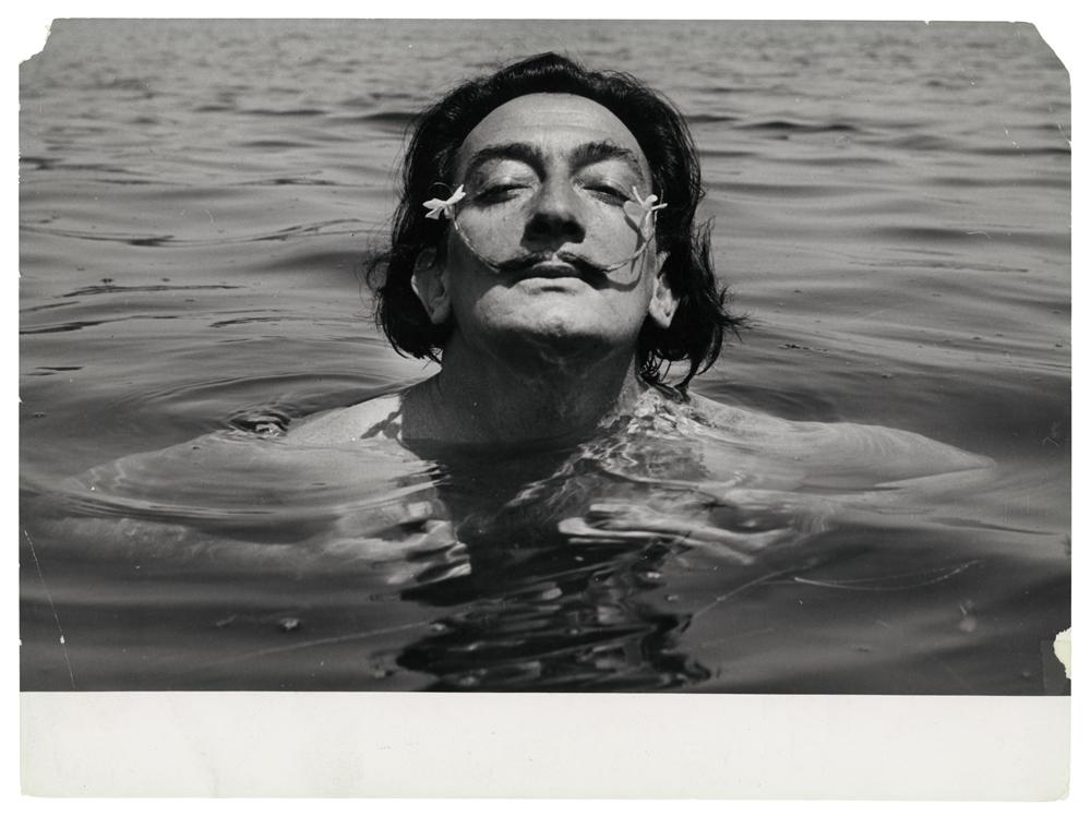 Spanish surrealist artist Salvador Dali swimming in 1953.