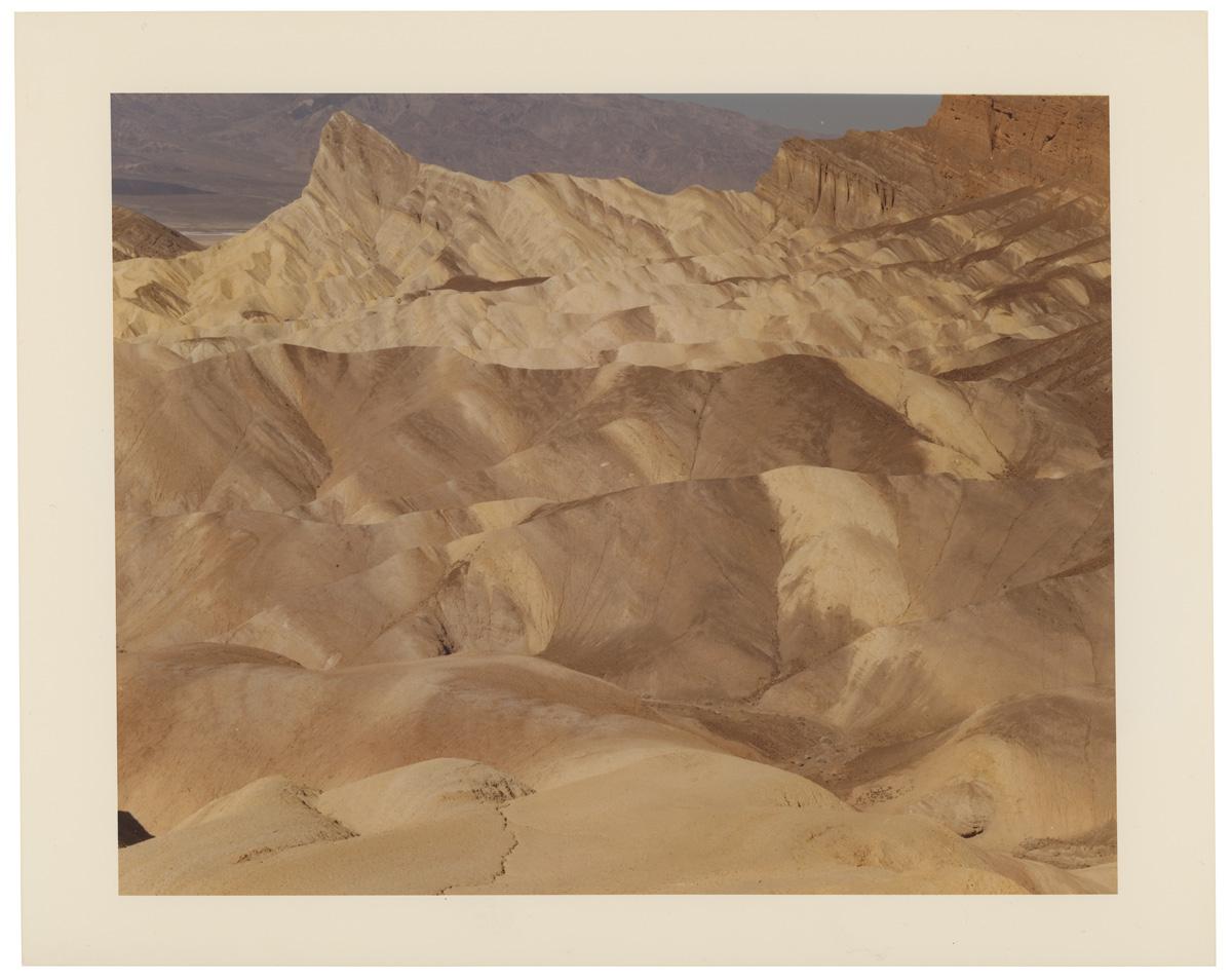 Photograph by Edward Burtynsky. A mountainous desert landscape.