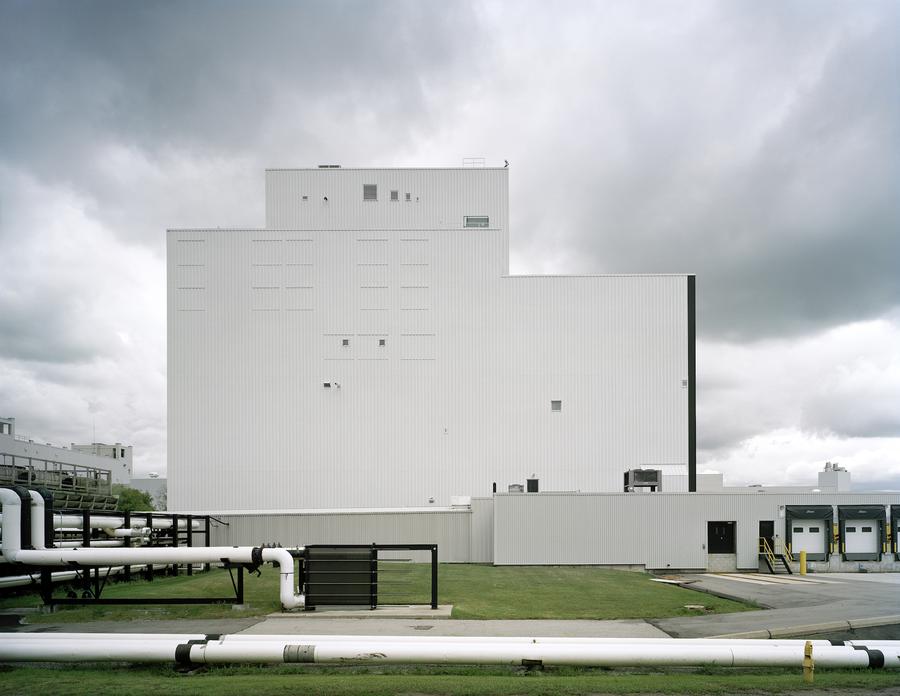 An angular white building with no windows