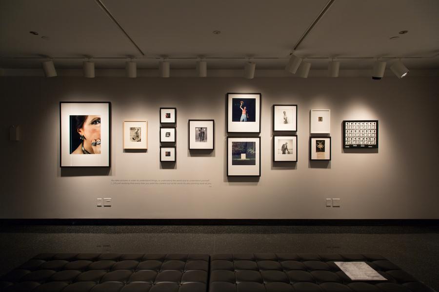 An arrangement of photographs in black frames