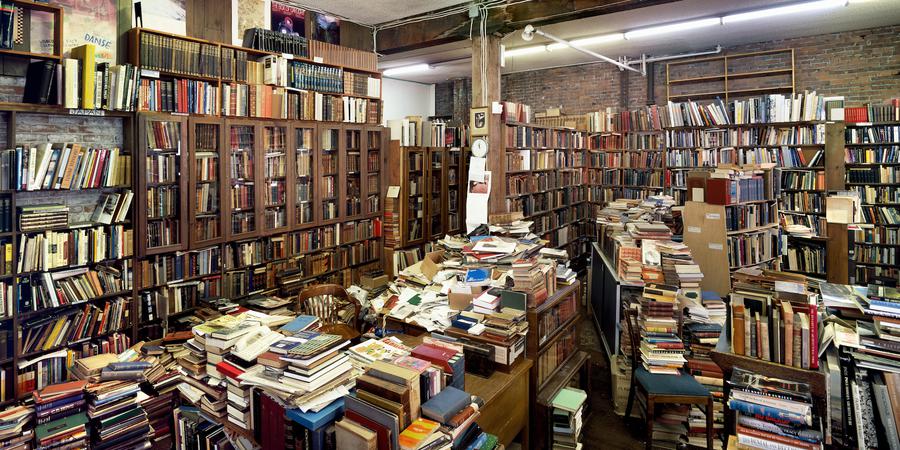 A bookstore with books strewn everywhere