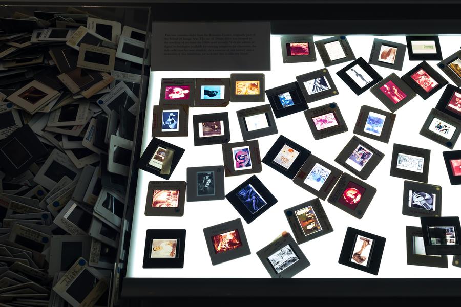 Dozens of tiny colourful photographs lit up from underneath
