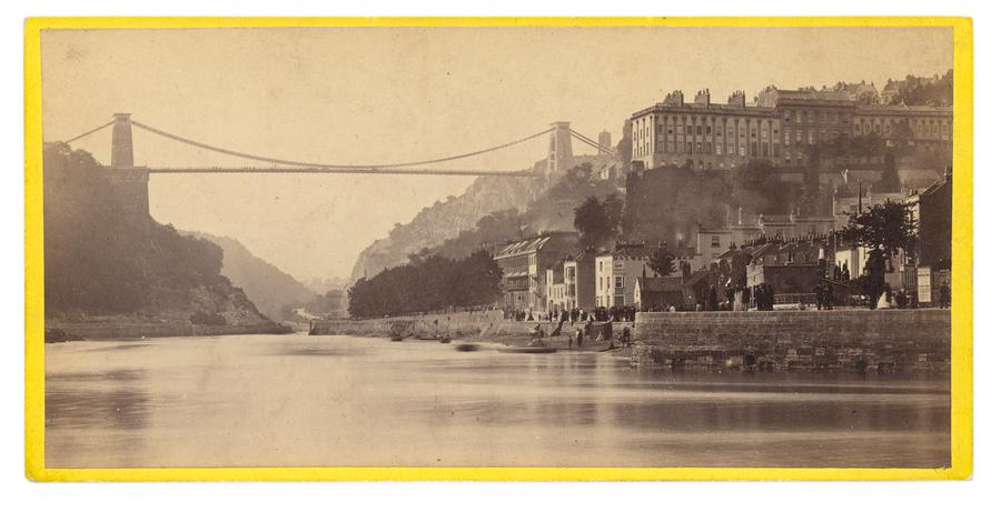 Panoramic photographic by Francis Bedford showing a suspension bridge connecting two sides of a river.