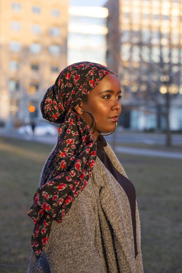 A girl wearing a floral headscarf
