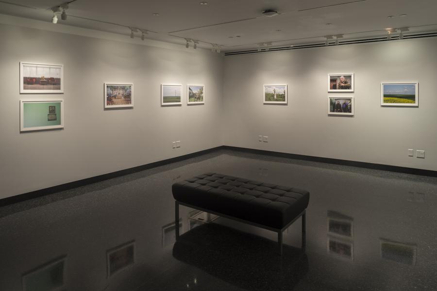 Wide view of the Student Gallery, black bench in the middle