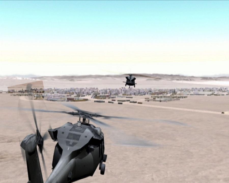 Animated still of a military helicopter flying over a desert town