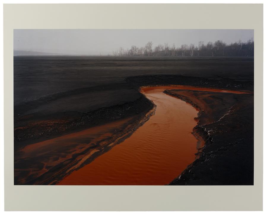 A red coloured river of iron slag in Sudbury, Ontario.