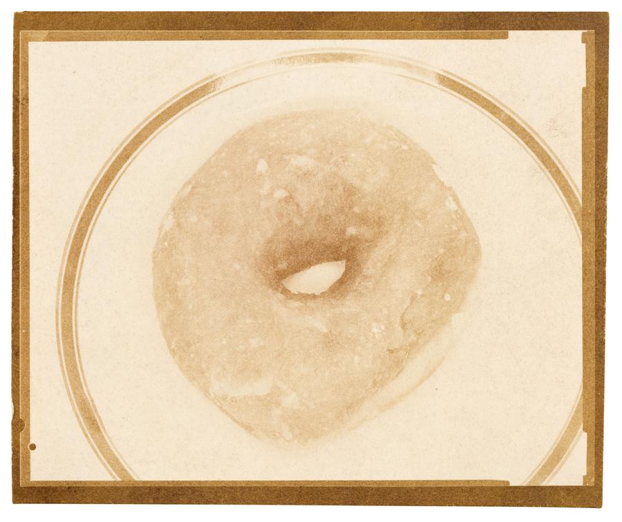 A close-up image of a donut on a plate