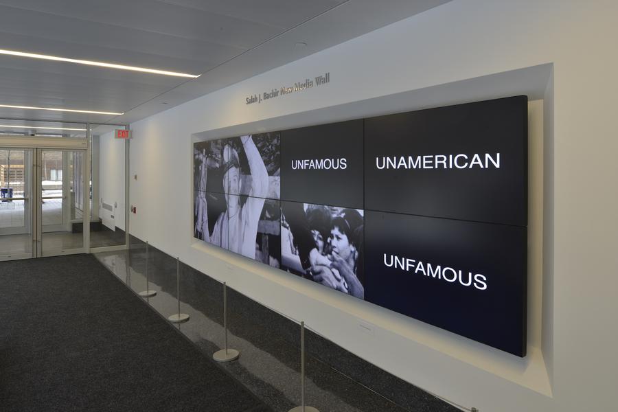A long screen playing a video, title reads "Unfamous UnAmerican Unfamous"
