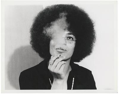 Woman smoking, smoke covering her face
